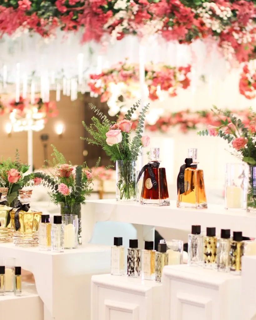 Wedding table setup with authentic luxury perfume favors